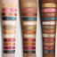 Arm swatch of the Master Metallics® Eyeshadow Palette on three different skin tones. 